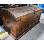 A dome top stand pine treasure chest with handles to the front. Length 90cm