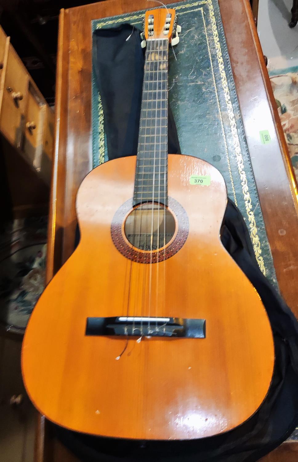 A Tatra Classic nylon string guitar, a Monet print and other pictures
