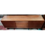 A mid 20th century teak sideboard designed by Nils Jonsson for Troeds with 4 central drawers and 2