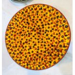 An Anita Harris Studio Charger with yellow & red glazed background, with brown & blue spots,