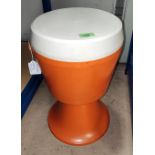 A vintage Dutch, plastic, orange and white stool/sewing box of a circular drum form.
