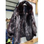 A lady's three quarter length dark mink coat