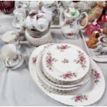 A Royal Albert Moss Rose part dinner and tea service, including a teapot, approx. 41 pieces.