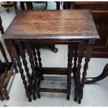 A set of oak barley twist occasional tables