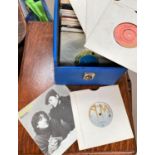 A selection of various single 45s in carry case