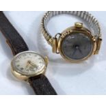 A lady's early/mid 20th century wristwatch in 9 carat hallmarked gold case, on expanding bracelet; a