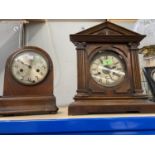 A late 19th century American mantel clock in architectural case; a mantel clock in arch top case;