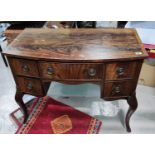 A mahogany dressing table with unusual carved cabriole legs