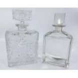 Two large glass display perfume bottles, squared form, 1 plain, the other with star cut pattern,