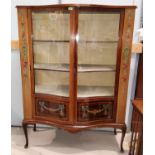 An Edwardian Sheraton style mahogany display cabinet with extensive inlaid and painted decoration,