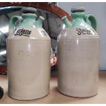 A near matching pair of Stoneware Advertising Flasks for Stergene washing liquid, with spout and ha