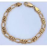 A yellow metal bracelet formed from alternating flattened elongated and triple links, stamped 375,