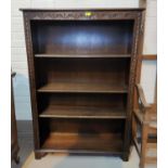 An oak period style 4 height carved bookcase