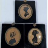 Three early 19th century silhouette in black and white, head and shoulder profiles of woman and 2
