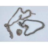 Two hallmarked silver Albert chains and a silver medallion