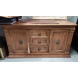 An oak period style side cabinet of 2 cupboards and 3 drawers
