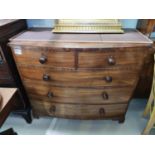 A 19th century mahogany bow front chest of 3 long and 2 short drawers with turned knob handles, on