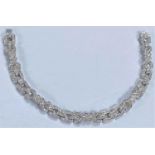 An 18ct hallmarked white gold Art Deco style diamond bracelet , each link encrusted with diamonds,