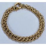 A 9ct hallmarked gold bracelet formed from circular and 'V' shaped links, 8.6gms