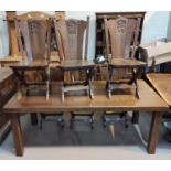 An oak period style dining suite, the table with heavy plank top and square legs, 6 chairs with