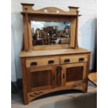 An Arts & Crafts oak sideboard with mirror back, square pillars, 2 side cupboards and2 drawers