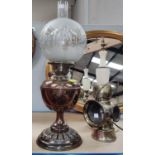 A copper oil lamp with etched shade and  "King Road" brass road lamp and an alabaster table lamp