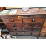 An early 19th century mahogany chest of 3 long and 2 short drawers with turned knob handles, on