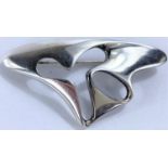 Georg Jensen, a pierced silver abstract brooch with makers stamp, No.325