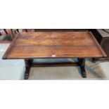 An oak period style coffee table with rectangular, on twin turned end supports