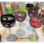 A set of 8 coloured cut glass hock wine glasses