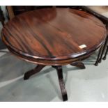 A mahogany coffee table with circular top on pedestal column; 2 occasional tables