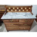 An Edwardian stripped and refinished washstand, with marble top and tile back, 2 short and 3 long