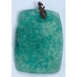 A rectangular turquoise jade coloured pendant in the Chinese manner with relief decoration of