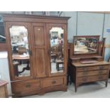 An Edwardian 3 piece bedroom suite com prising double mirror door wardrobe, dressing chest and
