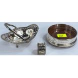 A hallmarked silver coaster, Birmingham; a hallmarked silver napkin ring; a silver plated bonbon