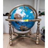 A modern 'Lapis' coloured marble effect globe on gilt gimbal stand