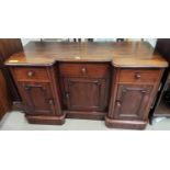 A Victorian reverse breakfront desk/side cabinet with 3 drawers an d 3 cupboards, on plinth