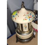 A 1950's musical revolving cigarette dispenser