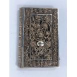 An early 19th century Chinese white metal filigree case in the form of a book with intricate pattern