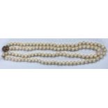 A double string cultured pearl necklace with 9ct gold clasp set with citrines and seed pearls,