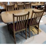 A modern Ercol elm dining suite comprising table with extending rectangular top, 2 spare leaves, and