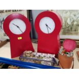 Two red metal wall hanging storage clocks; a cased flask set and other collectables.