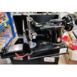 A Singer Portable Sewing Machine in original case, No/ 221K1