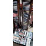 2 CD stands with CDs; a selection of DVDs, videos, boxed sets etc