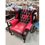 Georgian style wing back armchair in deeply buttoned oxblood hide