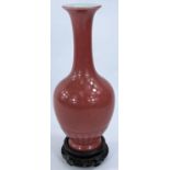A Chinese pink enamelled porcelain vase of baluster form, 6 character mark to base, 20cm (Good