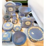 A selection of Wedgwood light blue Jasperware:  2 clocks; bowls; vases; etc.