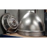 Five large industrial light shades in silvered metal; 2 vintage chrome hub caps