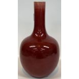 A Chinese sang de boeuf glazed stoneware bottle vase, height 22cm