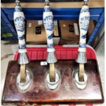 2 bar mounted blue and white ceramic beer engine handles